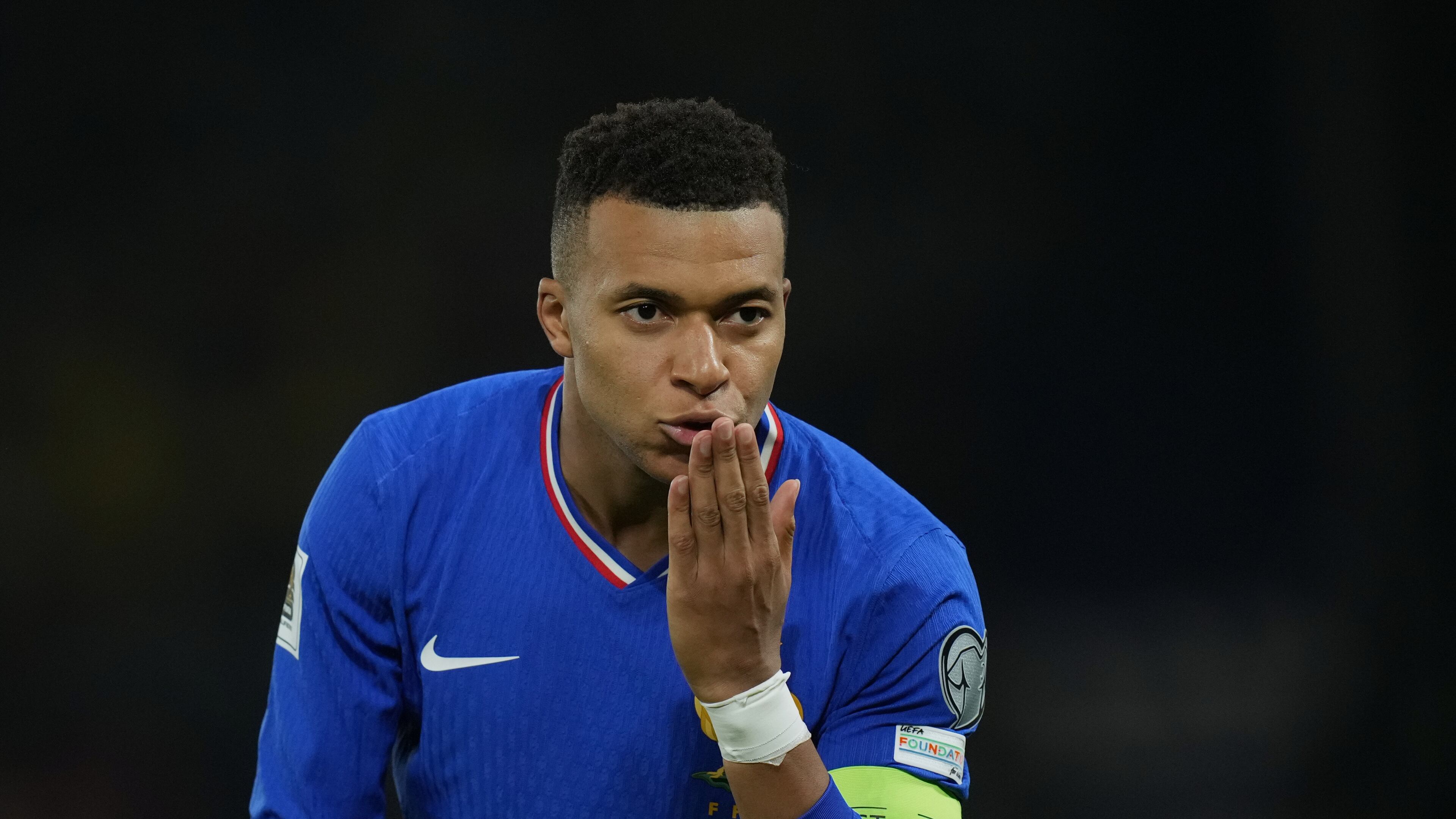 France's Kylian Mbappe celebrates the opening goal during a World Cup 2026 group D qualifying soccer match between France and Ukraine in Paris, Thursday, Nov. 13, 2025. (AP Photo/Christophe Ena)