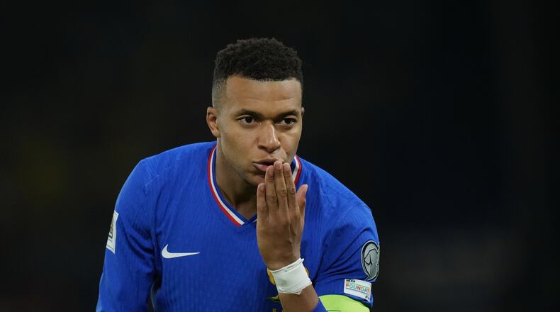 France's Kylian Mbappe celebrates the opening goal during a World Cup 2026 group D qualifying soccer match between France and Ukraine in Paris, Thursday, Nov. 13, 2025. (AP Photo/Christophe Ena)
