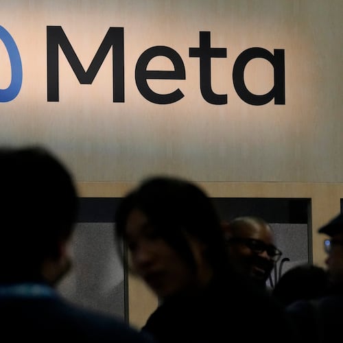 FILE - Attendees visit the Meta booth at the Game Developers Conference 2023 in San Francisco on March 22, 2023. (AP Photo/Jeff Chiu, File)