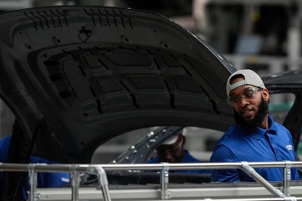 An employee works on the line during a media tour at the Hyundai Motor Group Metaplant America, Wednesday, March 26, 2025, in Ellabell, Ga. (AP Photo/Mike Stewart)