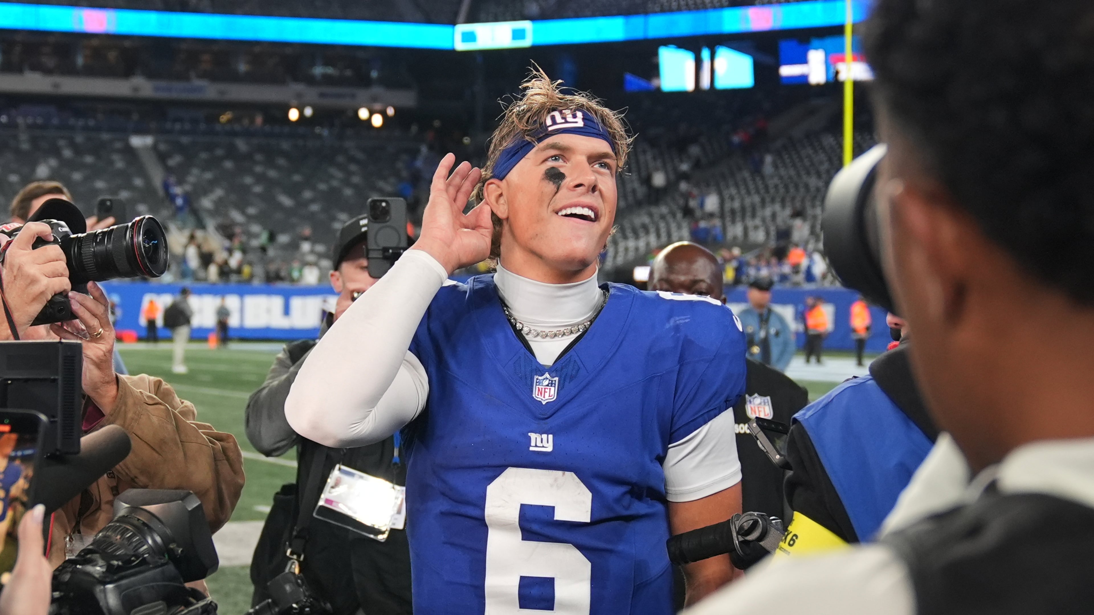 New York Giants' Jaxson Dart reacts after an NFL football game against the Philadelphia Eagles Thursday, Oct. 9, 2025, in East Rutherford, N.J. (AP Photo/Seth Wenig)