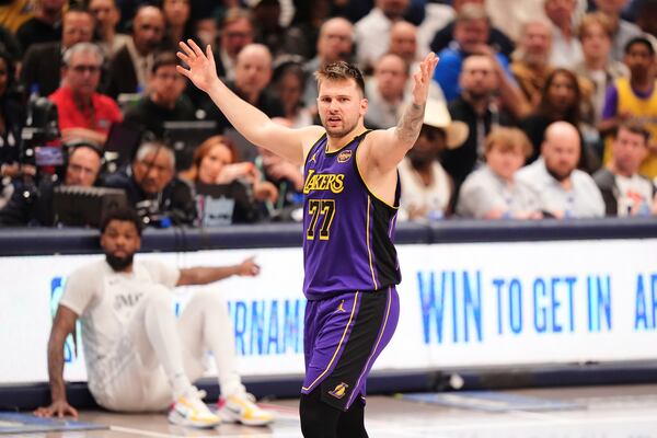 Los Angeles Lakers' Luka Doncic (77) reacts to play in the second half of an NBA basketball game against the Dallas Mavericks in Dallas, Wednesday, April 9, 2025. (AP Photo/LM Otero)