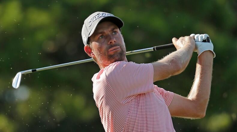 Webb Simpson watches his tee shot on the 16th hole during the third round of the Wyndham Championship golf tournament in Greensboro, N.C., Saturday, Aug. 19, 2017. (AP Photo/Chuck Burton)