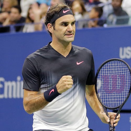 FILE - Roger Federer, of Switzerland, clenches his fist after wining a point against Feliciano Lopez, of Spain, during the U.S. Open tennis tournament in New York, Sept. 2, 2017. (AP Photo/Seth Wenig)