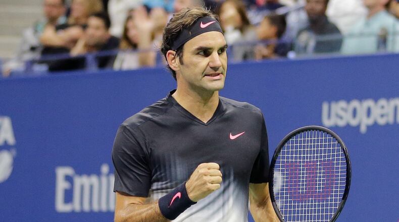 FILE - Roger Federer, of Switzerland, clenches his fist after wining a point against Feliciano Lopez, of Spain, during the U.S. Open tennis tournament in New York, Sept. 2, 2017. (AP Photo/Seth Wenig)