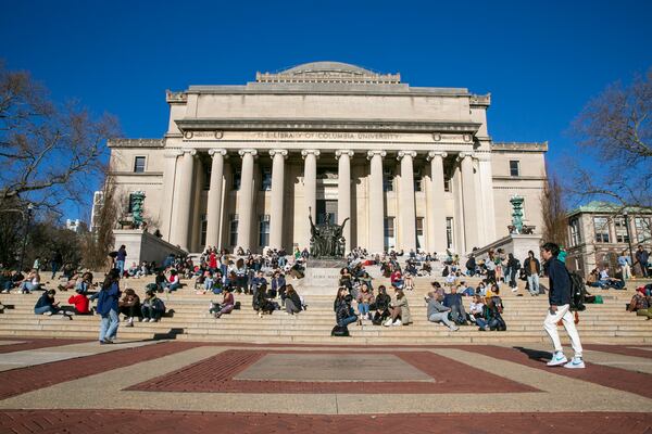 FILE - Students sit on the front steps of Low Memorial Library on the Columbia University campus in New York City, Feb. 10, 2023. (AP Photo/Ted Shaffrey, File)