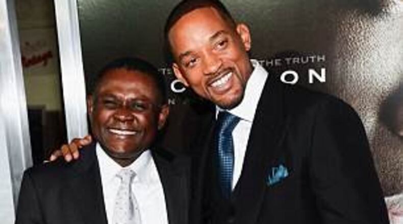 Dr. Bennet Omalu and Will Smith at the L.A. premiere of "Concussion."