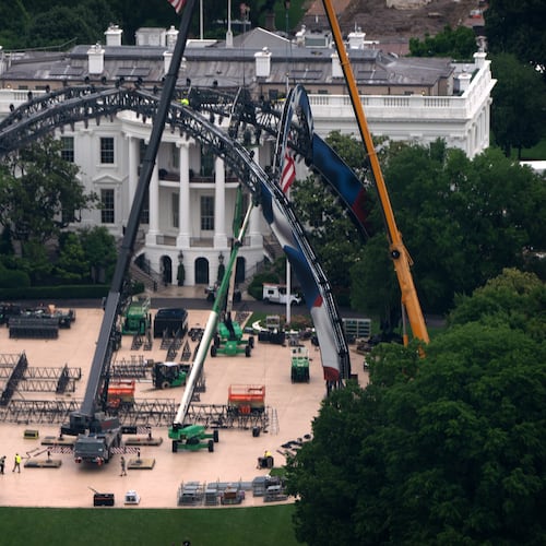 Equipment being placed on the South Lawn of the White House is seen from the Washington Monument, Tuesday, May 26, 2026, in Washington. The UFC is holding a mixed martial arts fight on June 14 as part of America 250 celebrations. (AP Photo/Mark Schiefelbein)