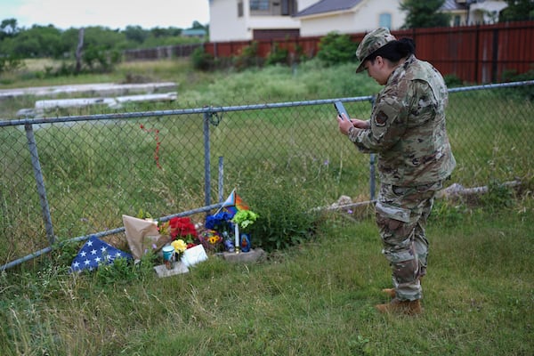 Candles, flowers, and notes make up make-shift memorial for voice actor Jonathan Joss who was recently killed, Tuesday, June 3, 2025, in San Antonio. (AP Photo/Eric Gay)