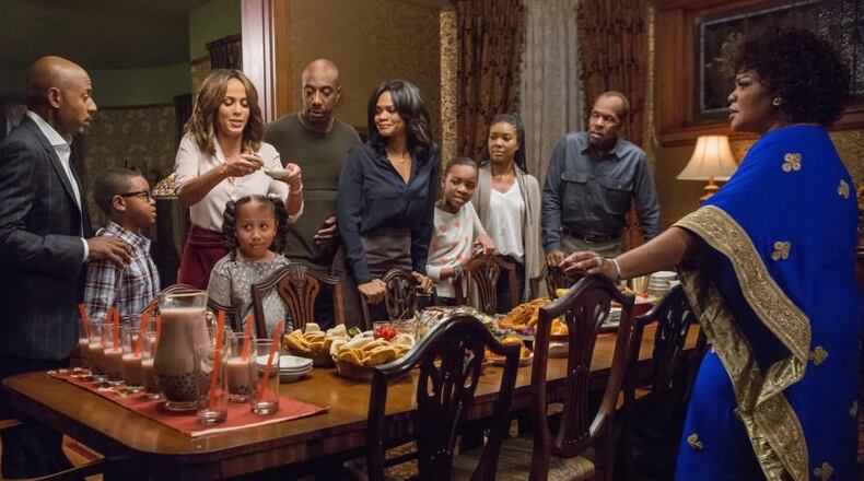 There's not much peace on earth happening around the family dinner table in locally filmed "Almost Christmas." Photo: Universal Pictures