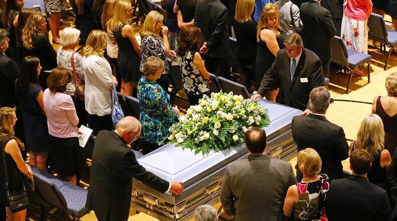 Mourners stand for the exit ceremony at the conclusion of a service of praise and celebration for the life of Emily Elizabeth Clark at Burnt Hickory Baptist Church on Sunday, April 26, 2015, in Powder Springs. Clark and four other nursing students from Georgia Southern University were killed in a multi-vehicle accident while fulfilling course work in their nursing program. (AJC/Curtis Compton)