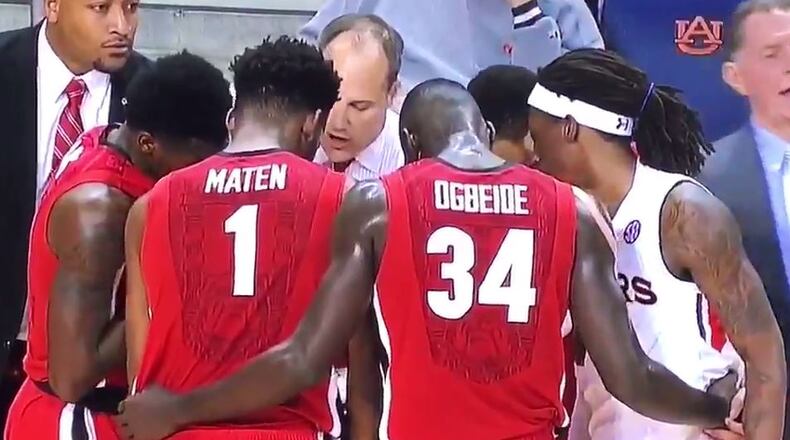 T.J. Dunans, an Auburn University basketball from DeKalb County, crashed his opponents' huddle. SETH EMERSON/SETH.EMERSON@COXINC.COM