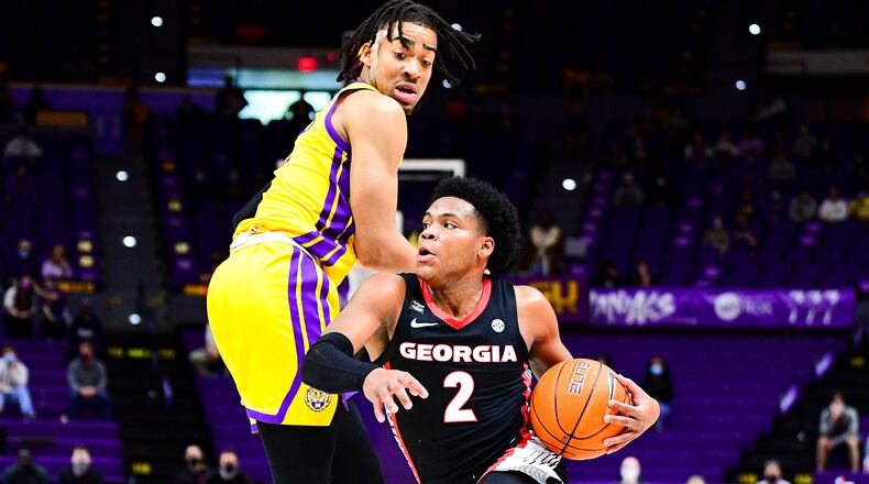 Georgia basketball player Sahvir Wheeler (2) drives past an LSU defender in a game at Pete Maravich Assembly center earlier this season. The Bulldogs' point guard leads the SEC and is fourth nationally in assists at 7.6 per game. (Beau Brune/LSU Athletics)