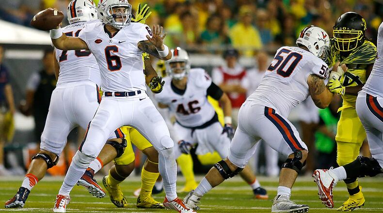 EUGENE, OR - SEPTEMBER 10: Kurt Benkert #6 of the Virginia Cavaliers throws the ball against the Oregon Ducks at Autzen Stadium on September 10, 2016 in Eugene, Oregon. (Photo by Jonathan Ferrey/Getty Images)