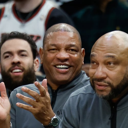 FILE - Milwaukee Bucks head coach Doc Rivers, center, applauds during the first half of an NBA basketball game against the Dallas Mavericks, March 31, 2026, in Milwaukee. (AP Photo/Jeffrey Phelps, File)