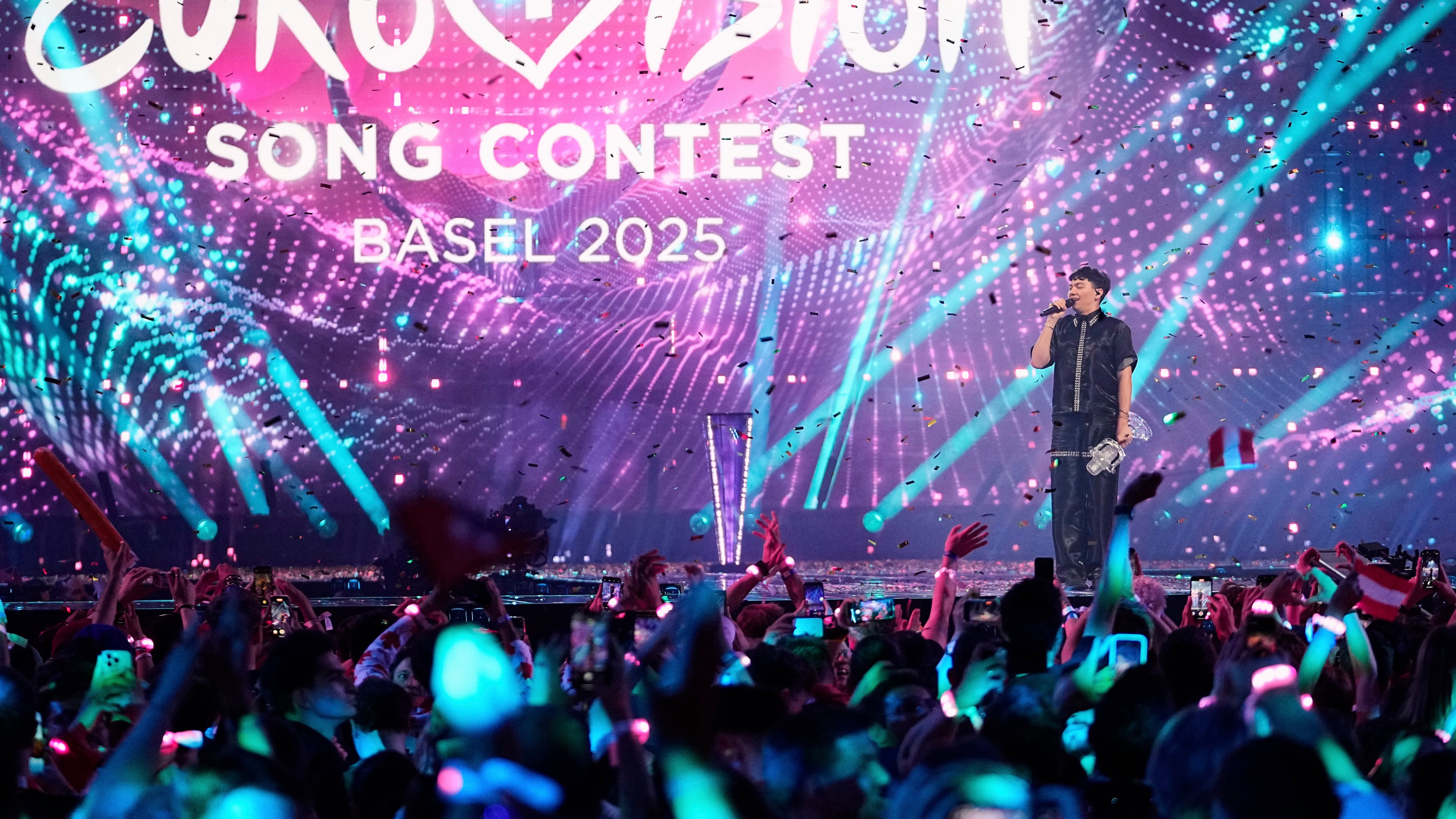 FILE - JJ from Austria stands on the stage with the trophy after winning the Grand Final of the 69th Eurovision Song Contest, in Basel, Switzerland, May 18, 2025. (AP Photo/Martin Meissner, File)