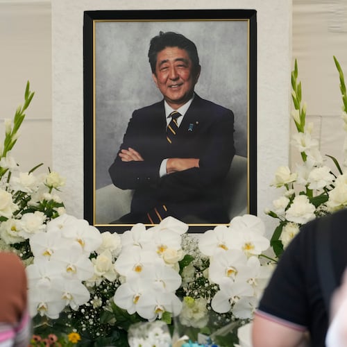 FILE - People offer prayers for former Prime Minister Shinzo Abe at Zojoji temple in Tokyo, Japan, July 8, 2023. (AP Photo/Shuji Kajiyama, File)