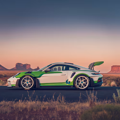 The Buzz Lightyear-inspired 911 GT3 RS features a white, green and purple
color scheme, a rear wing echoing the character's signature “wings" and custom
“Lightyear” tires. (Courtesy of Porsche Cars North America)