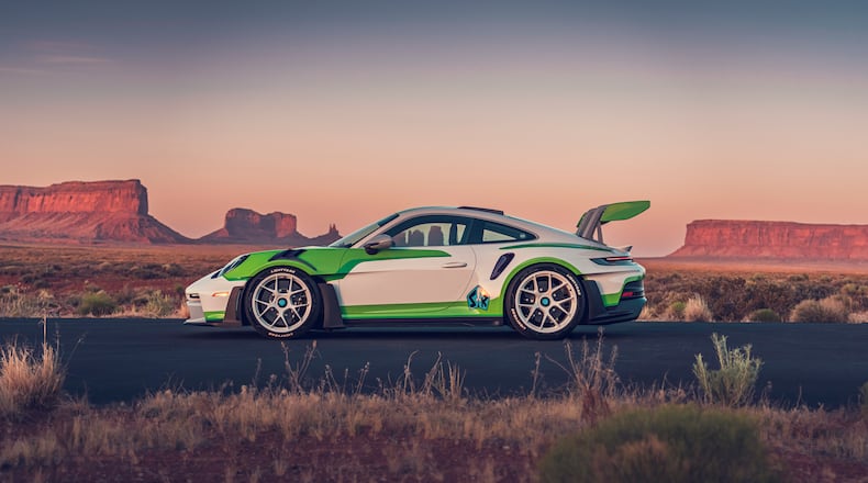 The Buzz Lightyear-inspired 911 GT3 RS features a white, green and purple
color scheme, a rear wing echoing the character's signature “wings" and custom
“Lightyear” tires. (Courtesy of Porsche Cars North America)