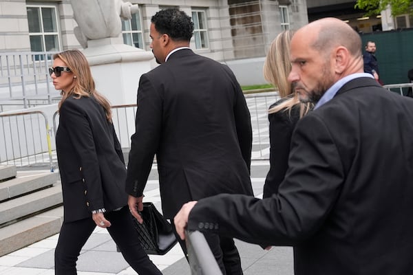 Interim US Attorney for New Jersey Alina Habba, left, arrives to the courthouse in Newark, N.J., Thursday, May 15, 2025. (AP Photo/Seth Wenig)