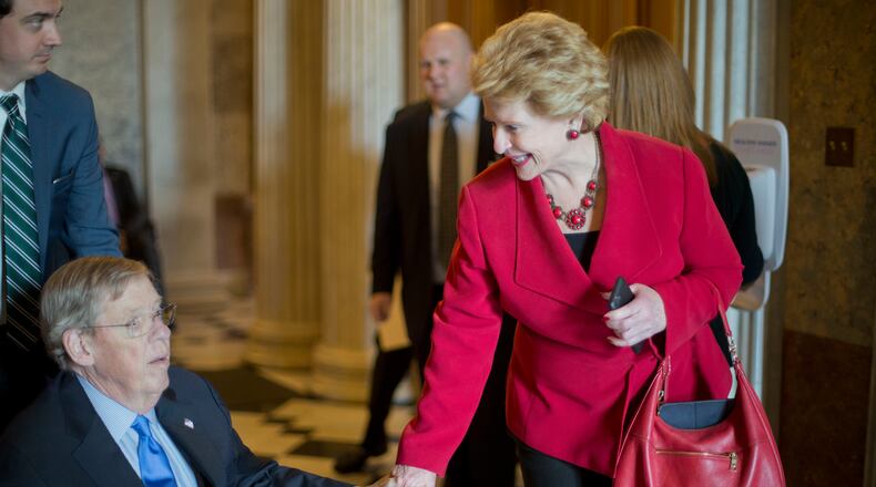 U.S. Sen. Debbie Stabenow, D-Mich., visits with U.S. Sen. Johnny Isakson, R-Ga., on Thursday after the GOP majority led a change to the Senate’s rules to lower the vote threshold for Supreme Court nominees. Isakson, who has been recovering at home in Marietta from two back surgeries, made a special trip to Washington for the vote and another vote expected Friday to confirm the Supreme Court nomination of Neil Gorsuch. (AP Photo/Pablo Martinez Monsivais)