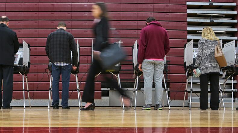 Voters cast ballots in the November of 2014 election at Grady High School in Atlanta. JOHN SPINK/JSPINK@AJC.COM