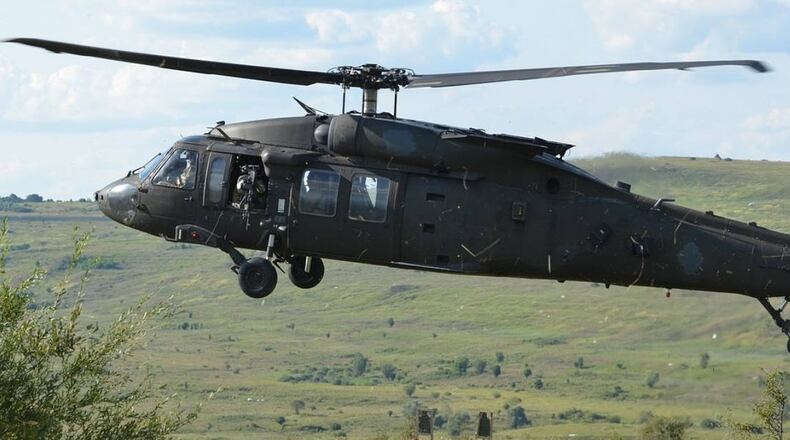 A Florida woman digitally included her husband, who is a helicopter pilot deployed overseas, onto a photo she is using for a Christmas card. (Military_Material/Pixabay)