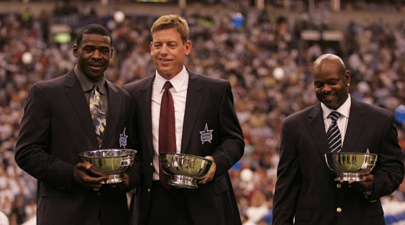 From left, Michael Irvin, Troy Aikman and Emmitt Smith at the Ring of Honor ceremony during halftime of a Dallas Cowboys game against the Washington Redskins at Texas Stadium in Irving, Texas, on September 19, 2005. (Tom Pennington/Fort Worth Star-Telegram/TNS)