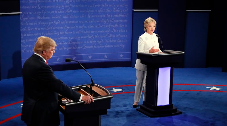 Democratic presidential nominee Hillary Clinton speaks as Republican presidential nominee Donald Trump listens during the third presidential debate at UNLV in Las Vegas, Wednesday, Oct. 19, 2016. (Mark Ralston/Pool via AP)