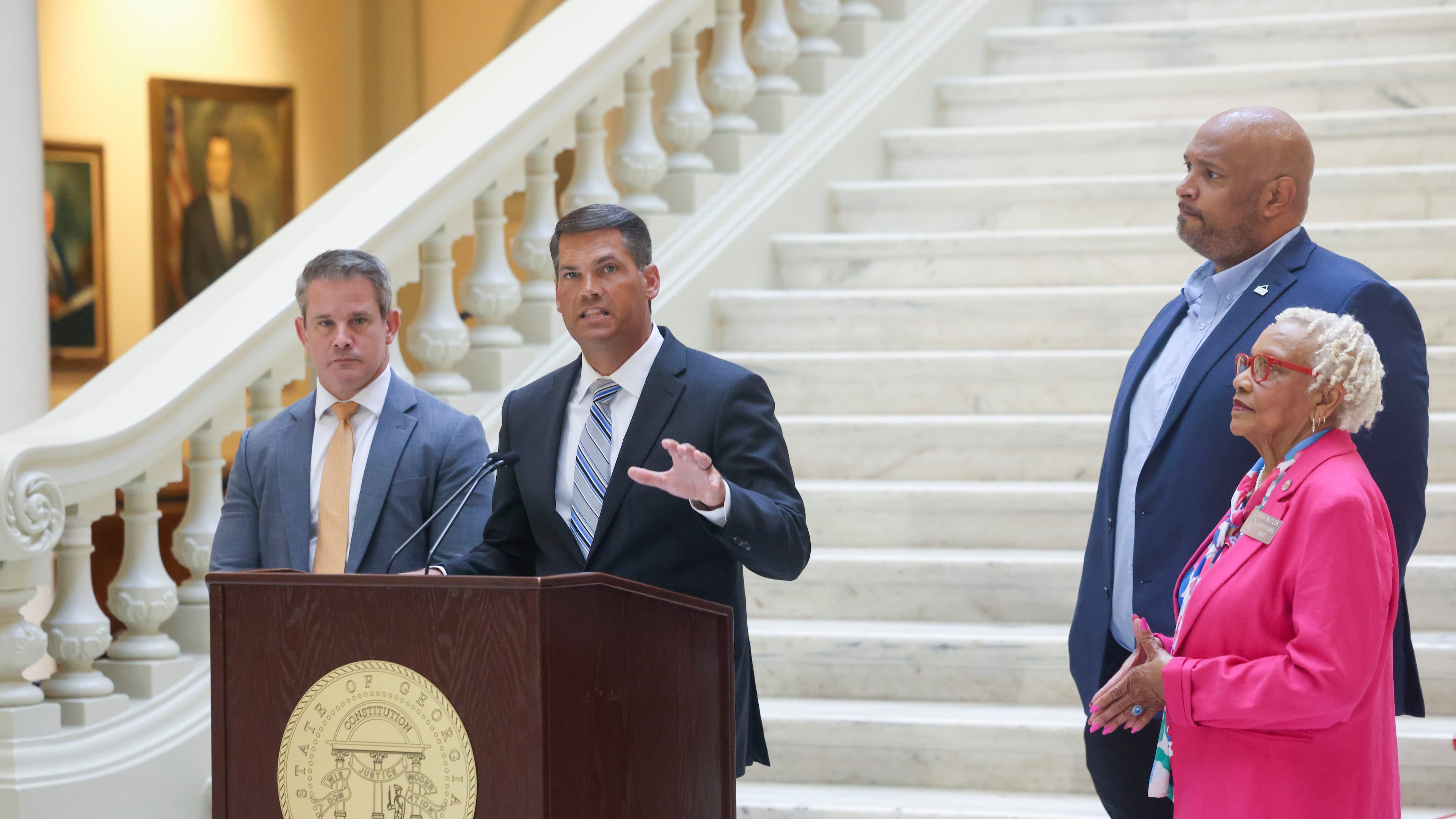 Former Republican Lt. Gov. Geoff Duncan (center, standing next to Gov. Brian Kemp) now says his values align better with the Democrats than the GOP. Readers had a lot to say about his switch. (Jason Getz/The Atlanta Journal-Constitution/TNS)
