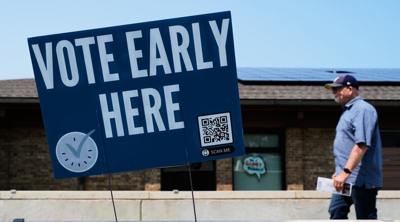 A voter walks to polling place in Milwaukee, Tuesday, July 28, 2026. (AP Photo/Nam Y. Huh)