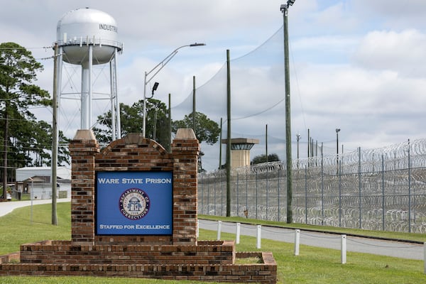 Razor wire and guard towers are visible at the Ware State Prison in Waycross.