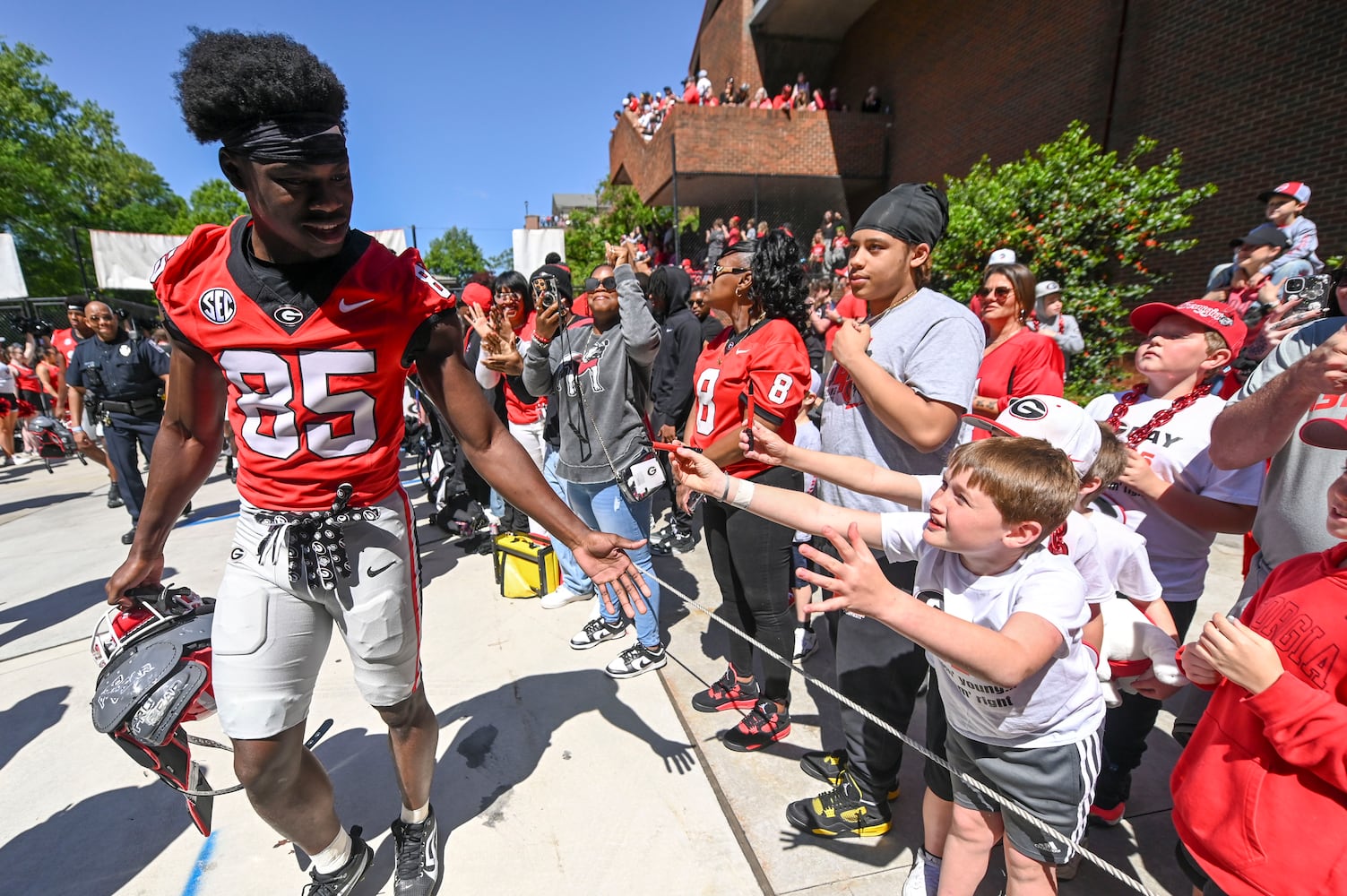 Georgia offensive linebacker Chase Linton (86) greets fans during the Dawg Walk During the first half of the G-Day spring football game Saturday, April 12, 2025 at Sanford Stadium in Athens. (Daniel Varnado/For the Atlanta Journal-Constitution)