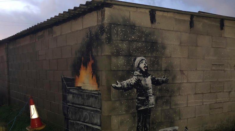 British street artist Banksy confirmed that art on a garage wall in Wales was done by him.