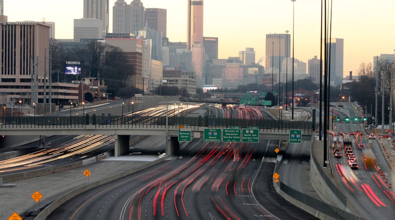 Traffic moving on Friday morning. JOHN SPINK/JSPINK@AJC.COM