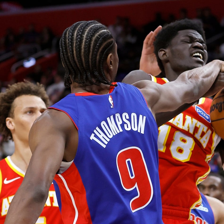 Atlanta Hawks forward Mouhamed Gueye (18) is defended by Detroit Pistons guard Ausar Thompson (9) while going to the basket during the first half of an NBA basketball game Friday, Dec. 12, 2025, in Detroit. (AP Photo/Duane Burleson)