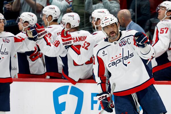 Washington Capitals' Alex Ovechkin (8) celebrates a goal against the Carolina Hurricanes during the second period of an NHL hockey game in Raleigh, N.C., Wednesday, April 2, 2025. (AP Photo/Karl DeBlaker)