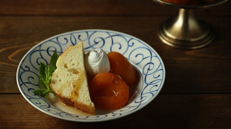 Apricots are poached in a water bath simply flavored with sugar, lemon juice and vanilla bean, creating a dessert whose payoff is much greater than the sum of its parts.
(E. Jason Wambsgans/Chicago Tribune/TNS)