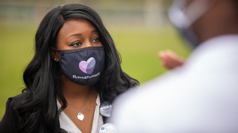 Nicole Love Hendrickson, running for Gwinnett Commissioner, speaks to attendees at the Get Out The Early Vote with Jon Ossoff, Rev. Raphael Warnock, Carolyn Bourdeaux, and the Biden Campaign at Shorty Howell Park in Duluth, Georgia, on Saturday, October 24, 2020. (Rebecca Wright for the Atlanta Journal-Constitution)