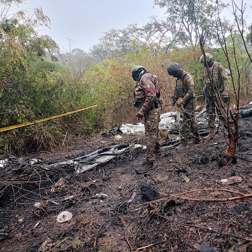 Kenyan officials inspect the scene of a plane crash near Diani, Kenya, Tuesday, Oct. 28, 2025. (AP Photo)