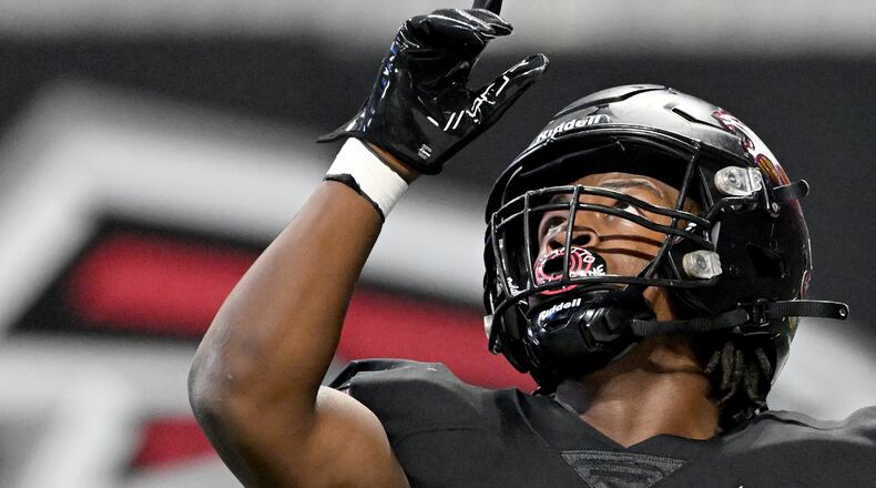 Hebron Christian's running back Devon Caldwell (17) celebrates after scoring a touchdown during the first half in GHSA Class 3A-A Private State Championship game at Mercedes-Benz Stadium, Wednesday, December 18, 2024, in Atlanta. (Hyosub Shin / AJC)
