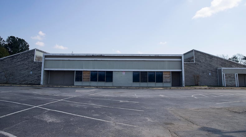 A developer is in talks to buy the dilapidated Sprayberry Crossing shopping center in East Cobb to transform into a mixed-use project featuring retail, office space and residential components. Alyssa Pointer/alyssa.pointer@ajc.com