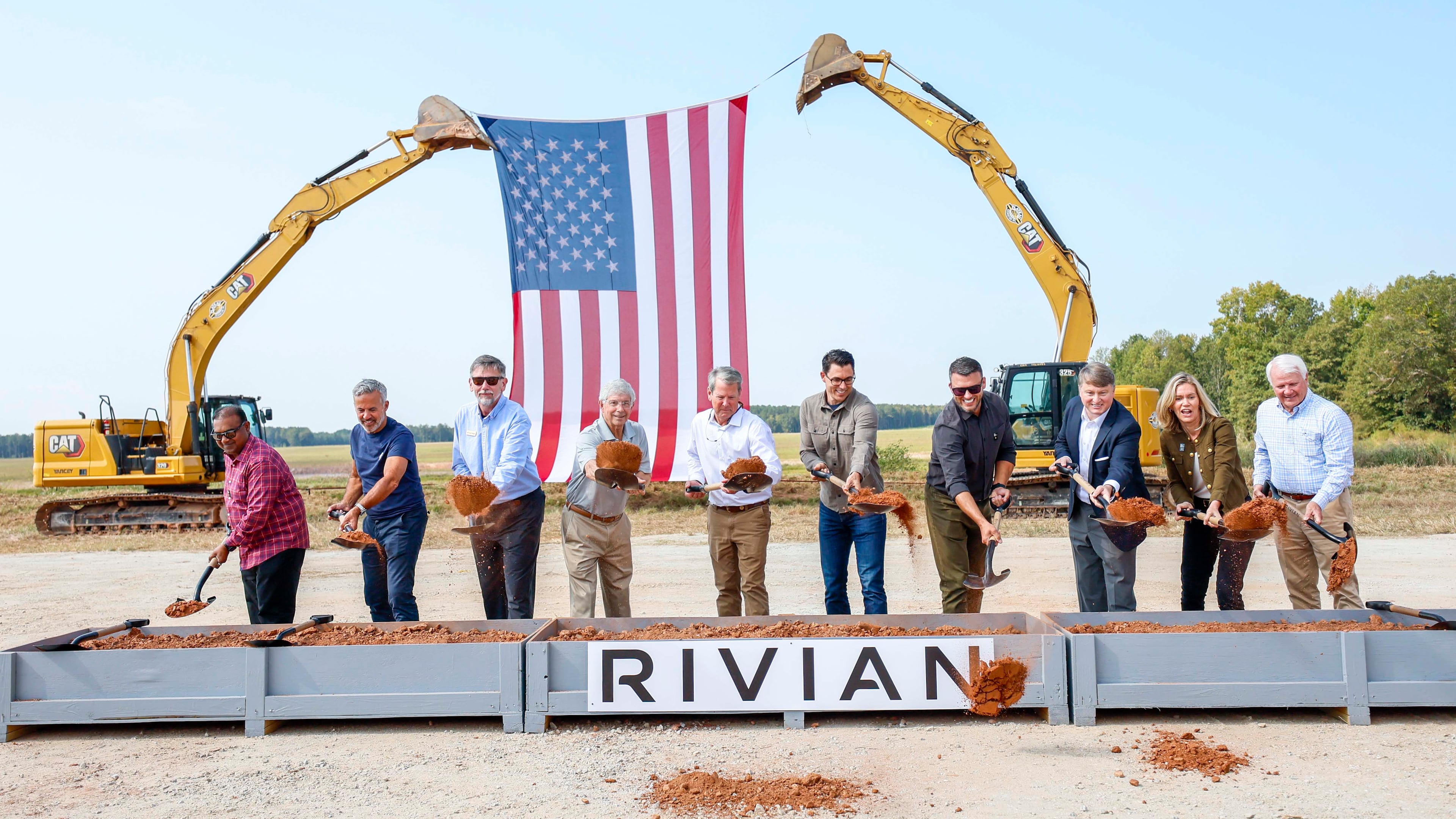 Rivian CEO RJ Scaringe, Gov. Brian Kemp and House Speaker Jon Burns, along with a special guest, participate in the groundbreaking ceremony Sept. 16, 2025, in Walton and Morgan counties. (Miguel Martinez/AJC)
