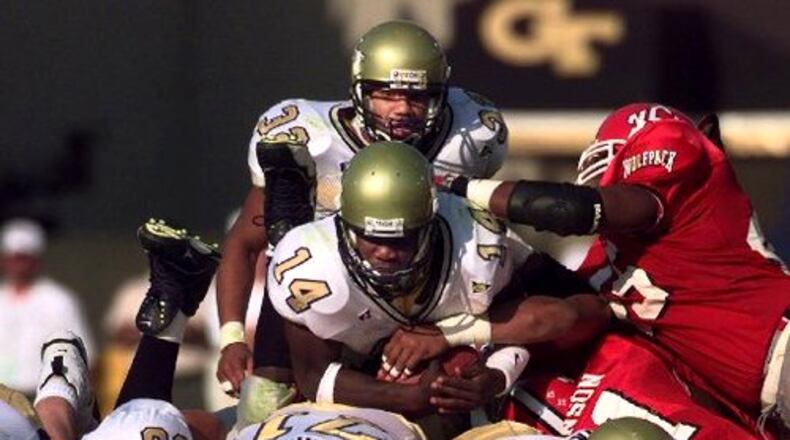Georgia Tech quarterback Joe Hamilton (14) also rushed for 1,758 yards at Tech, another school record. In 1999, he ran for 734 yards, setting another mark.
