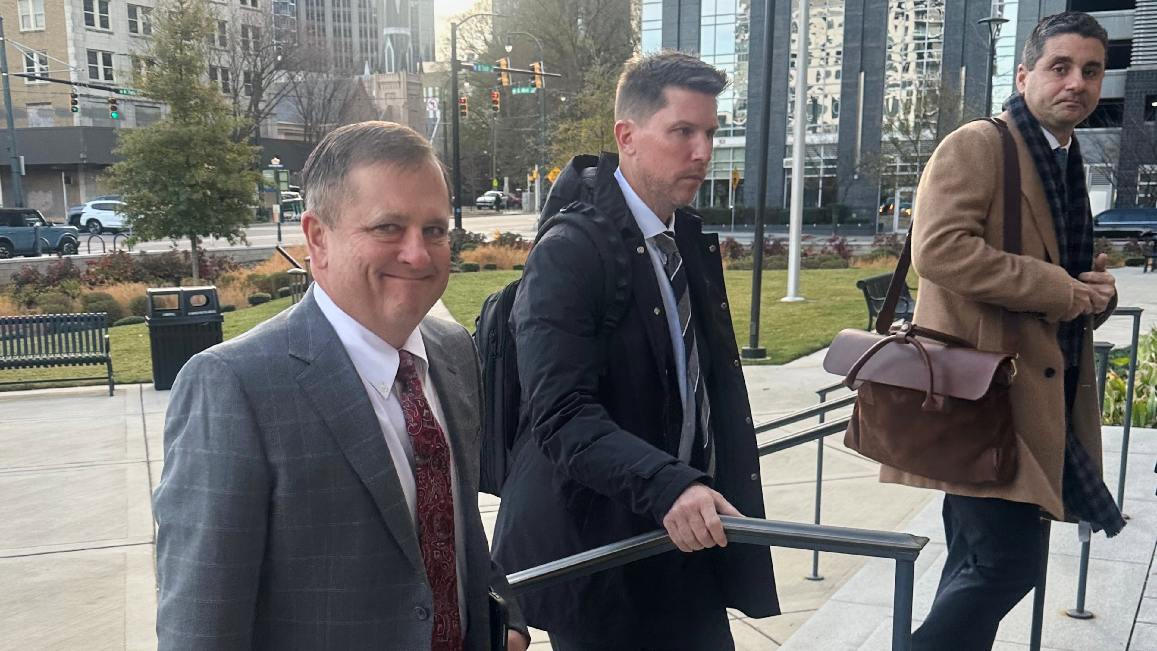FILE - Front Row Motorsports owner Bob Jenkins, left, and 23XI co-owner Denny Hamlin arrive in the Western District of North Carolina on Monday Dec 1, 2025 in Charlotte, N.C. (AP Photo/Jenna Fryer, File)