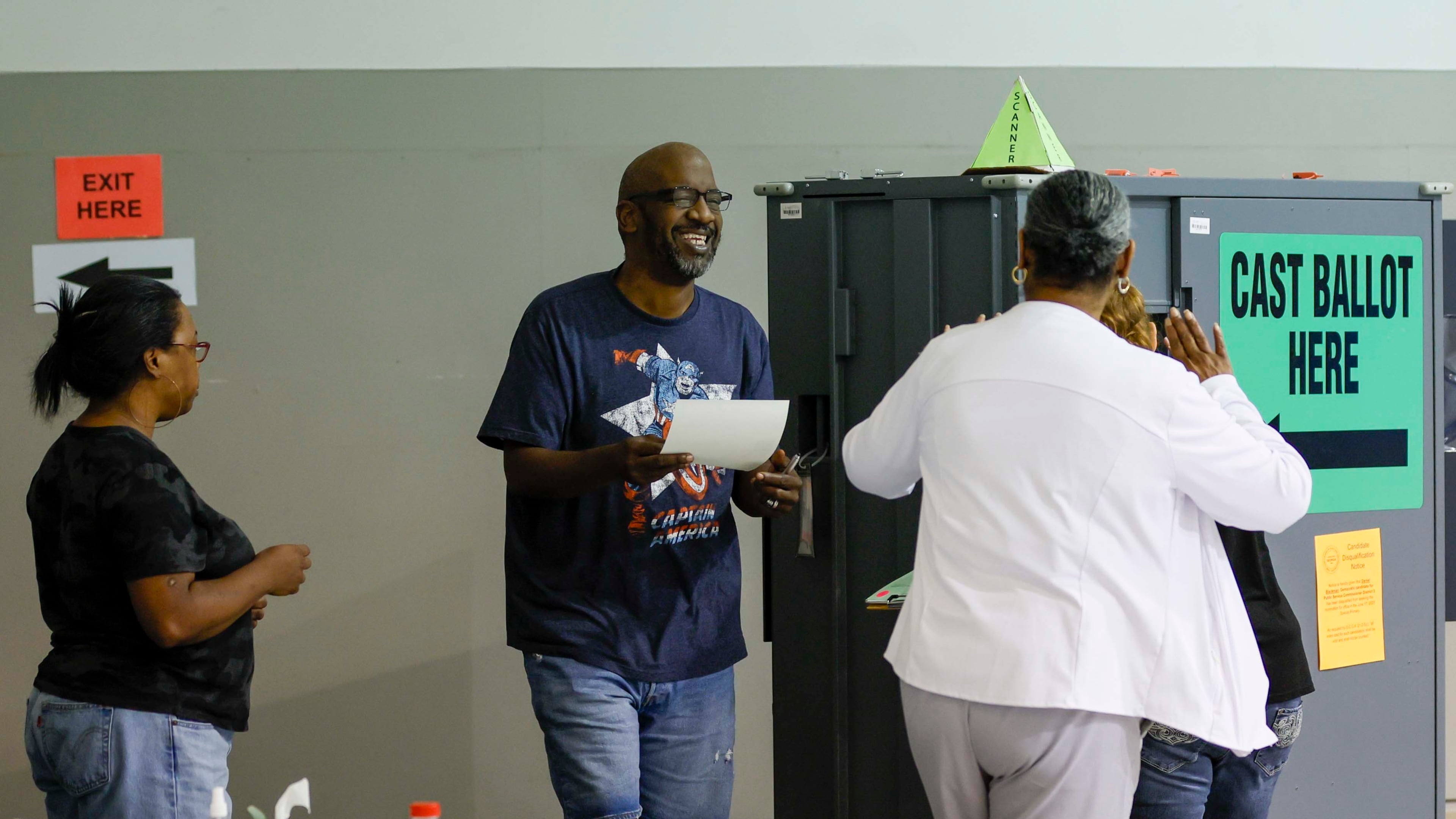Verlyn Hill gets ready to cast his ballot as he gets help from a poll worker at Calvary Baptist Church in Austell during the special election for the Georgia Public Service Commission on Tuesday, June 17, 2025. (Miguel Martinez/AJC)