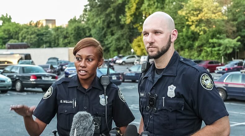 Officers Brittany Williams and Charles Tierney helped pull a man from a burning vehicle in Buckhead on Sunday morning. The man was not burned and no officers were injured.
