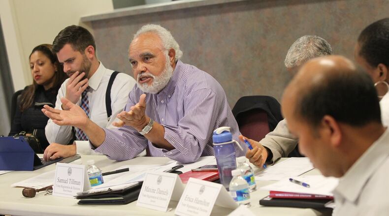 Samuel Tillman, chairman for the DeKalb County Elections Board, talks to voters about the possibilities for early voting sites on April 24, 2017. (HENRY TAYLOR / HENRY.TAYLOR@AJC.COM)