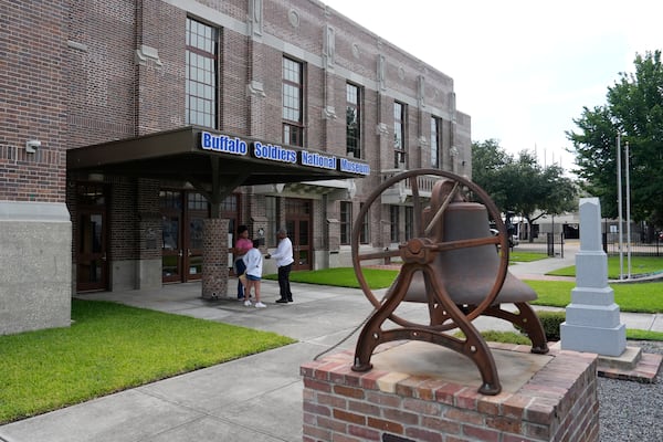 Patrons stand outside the Buffalo Soldiers National Museum on Friday, June 27, 2025, in Houston, Texas. (AP Photo/Ashley Landis)
