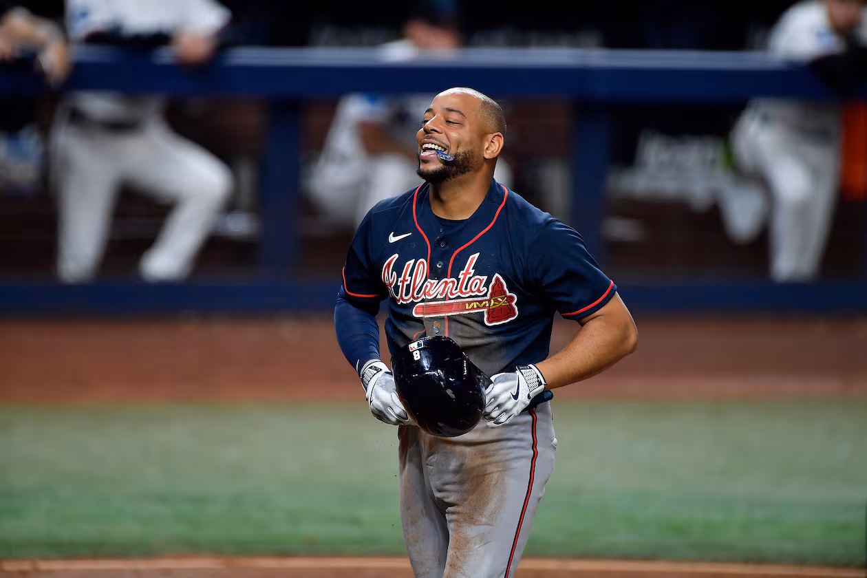 Atlanta Braves designated hitter Dominic Smith reacts to scoring a run during the eighth inning of a baseball game against the Miami Marlins, Wednesday, May 20, 2026, in Miami. (AP Photo/Michael Laughlin)